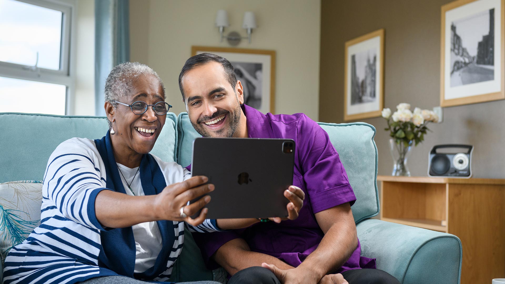 image of Anchor care worker and resident using facetime